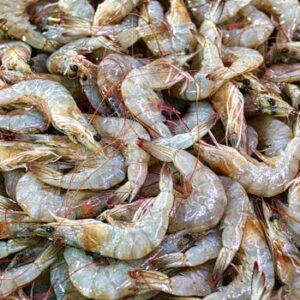 A close-up of fresh raw prawns displayed at a seafood market in Banten, Indonesia.
